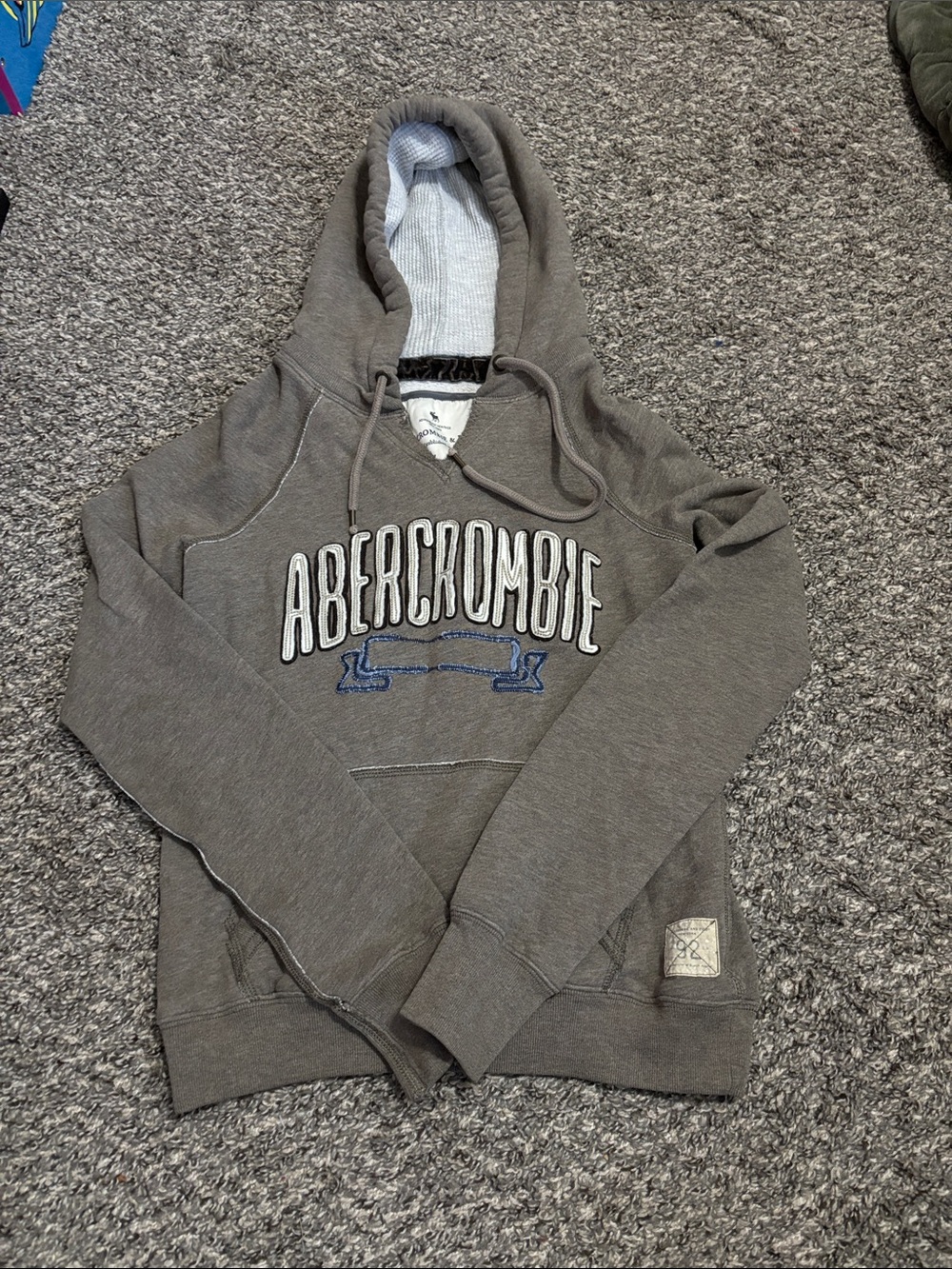 vintage gray-brown Abercrombie & Fitch pullover hoodie featuring a prominent emb